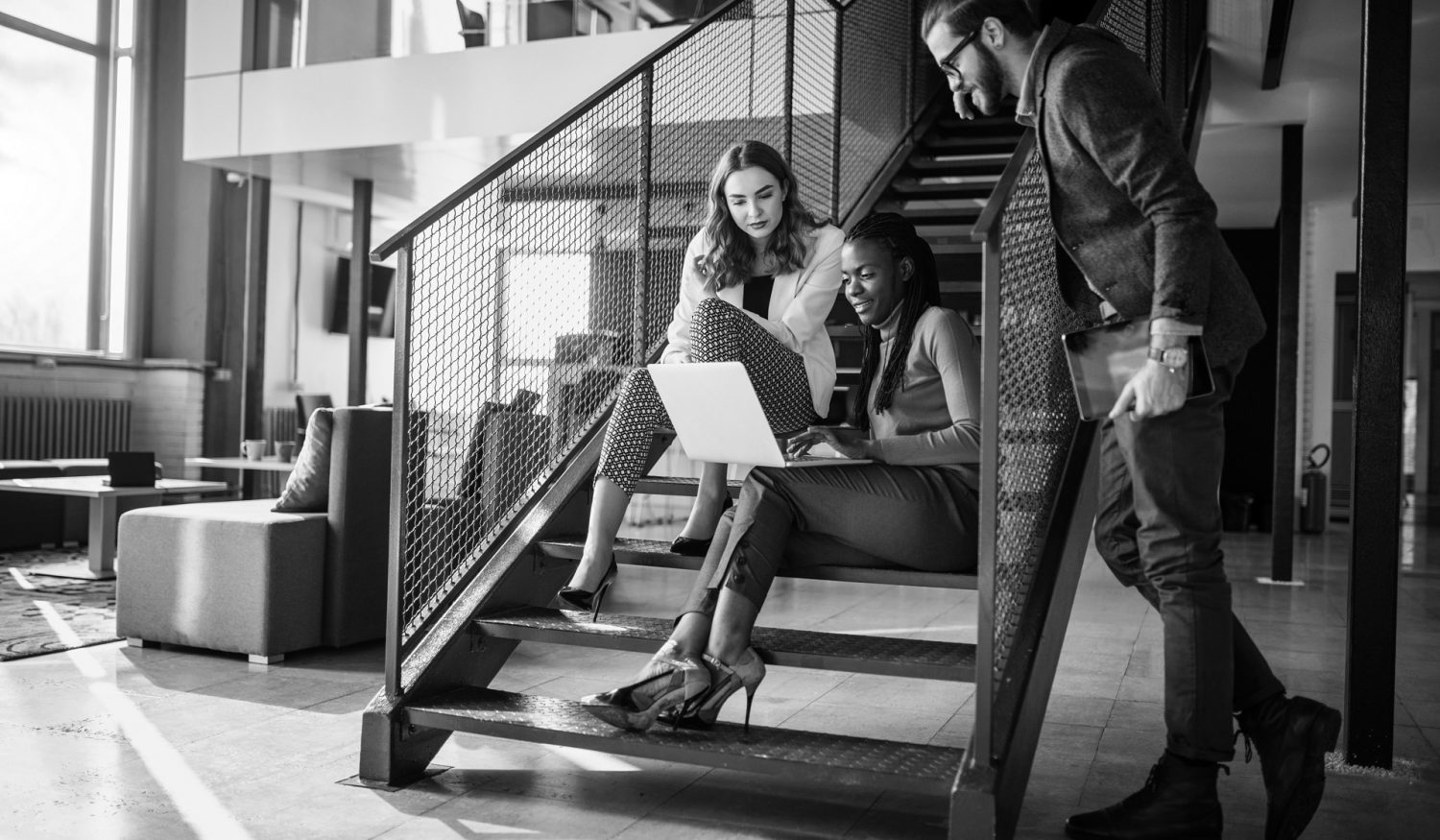 Business People sitting on staircase after finishing their work